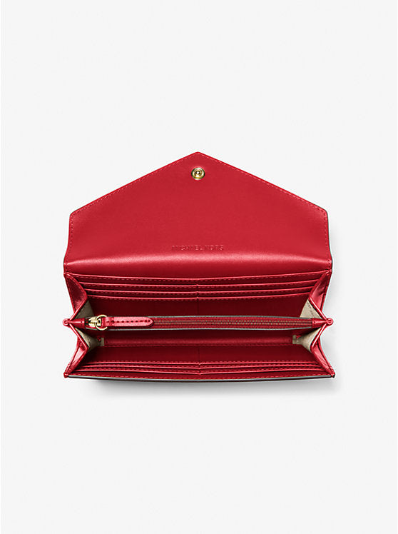 Michael Kors Jet Set Travel in pelle metallizzata rossa.